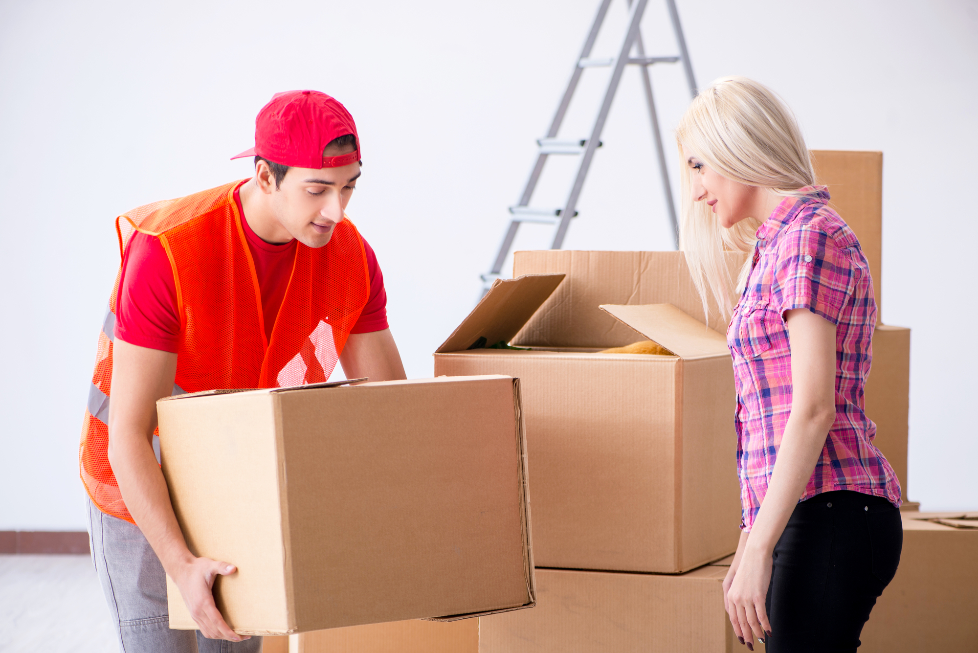 Young delivery assistant delivering to home